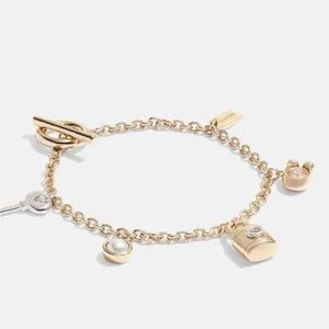 BRAND NEW gold coach bracelet, still in the package. Paid $51.